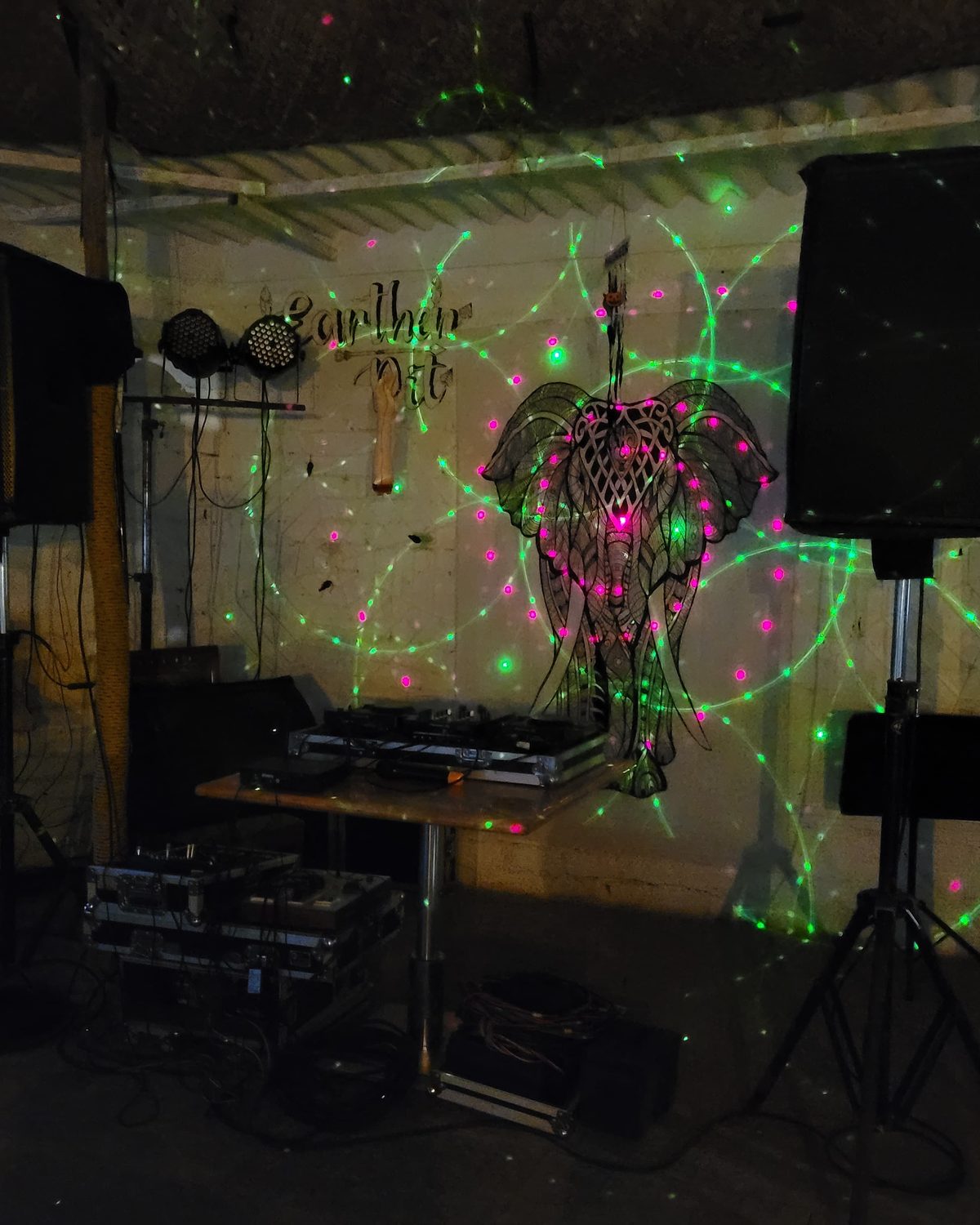 the café stage lit for an open-mic night