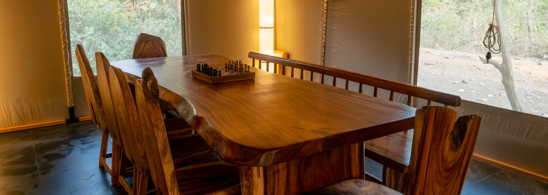 the live-edge dining slab set for eight, chess board mid-game